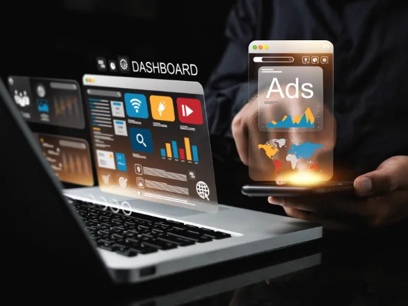 Google Ads management dashboard and campaign performance graphs on a laptop